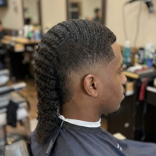 . Wavy Burst Fade Mohawk